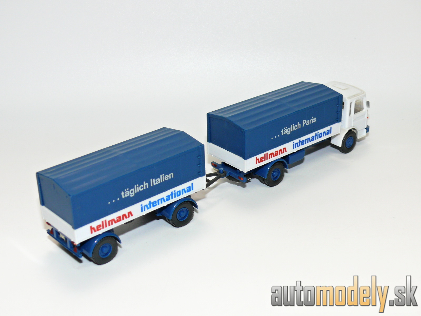 Wiking 424/6 - MAN 12.170 Pritschen-anhänger "Hellmann International" - HO 1:87