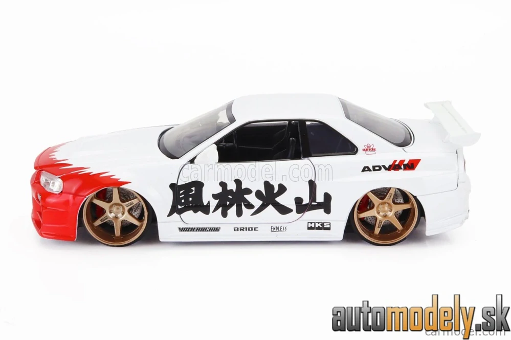 JADA - NISSAN - SKYLINE GT-R (R34) ADVAN 2002 WITH STREET FIGHTER RYU FIGURE - 1:24